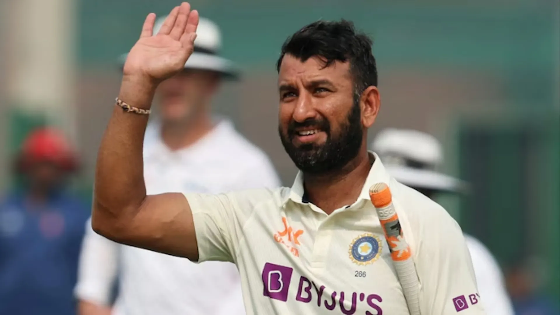 Cheteshwar Pujara in India cricket jersey playing defensive shot during Test match