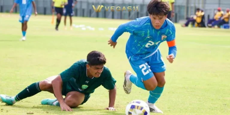 Indian U17 football team celebrating goal against Pakistan during SAFF championship with stadium crowd in background