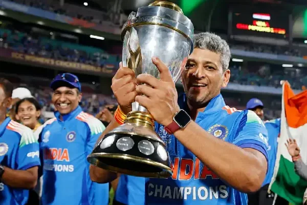 Indian women cricket team head coach Amol Muzumdar celebrating maiden ODI World Cup championship trophy 2025 with players at stadium