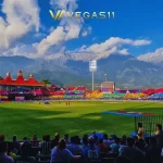 Dharamsala Cricket Stadium HPCA at night during IPL 2026 with snow-capped Dhauladhar mountains in the background