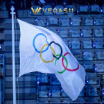 Qatari officials hold the Olympic Council of Asia flag at the Asian Games closing ceremony in Nagoya as Qatar eyes the 2036 Olympics